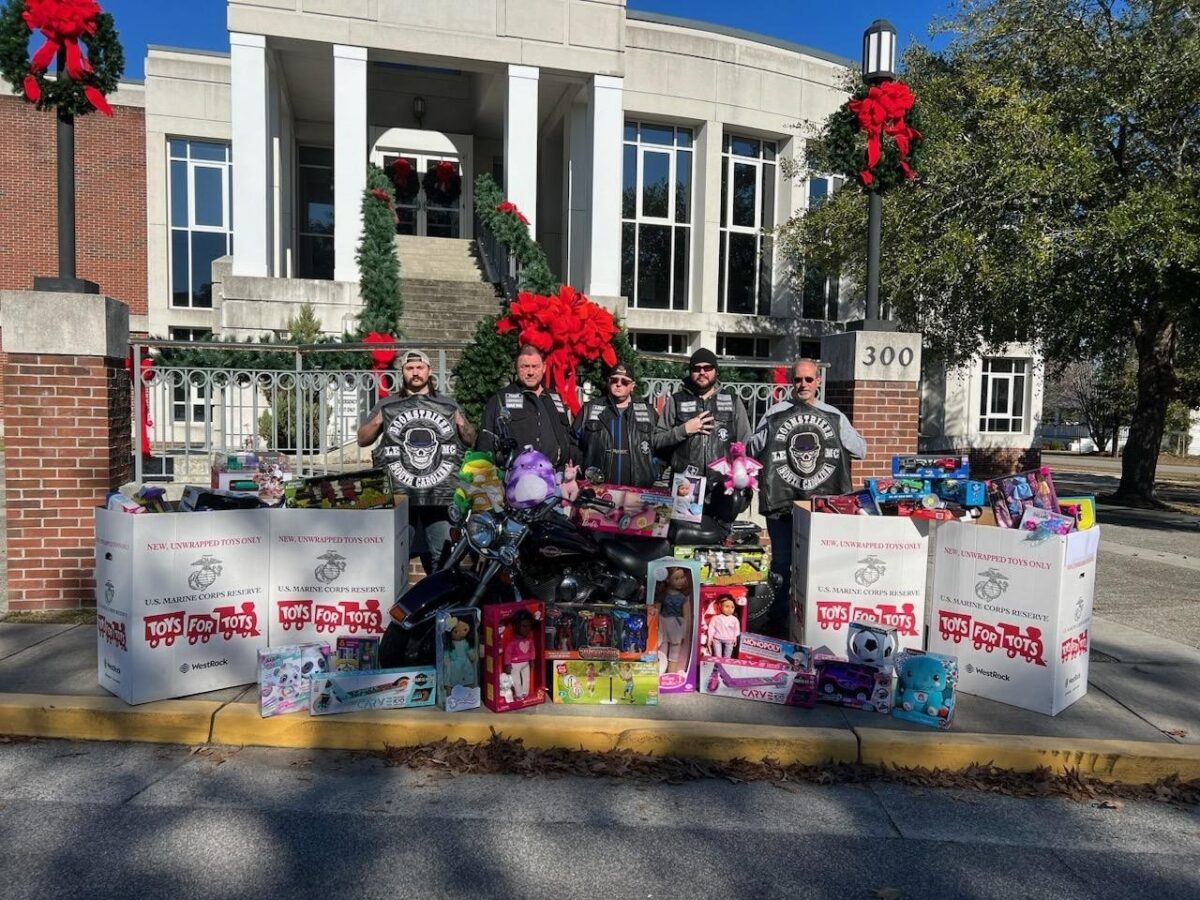 Motorcycle club donates hundreds of toys to NCPD for Toys for Tots