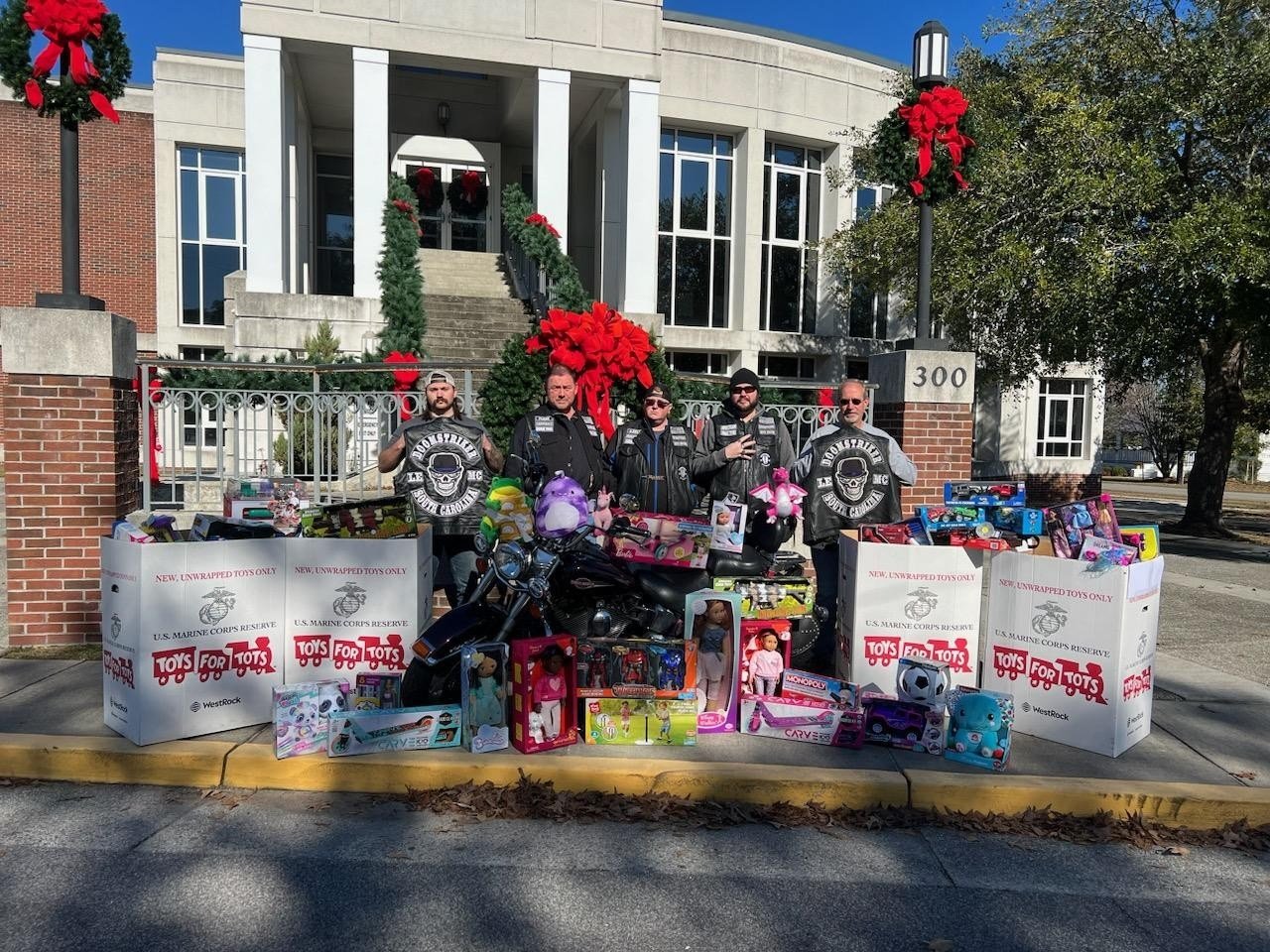 Motorcycle club donates hundreds of toys to NCPD for Toys for Tots